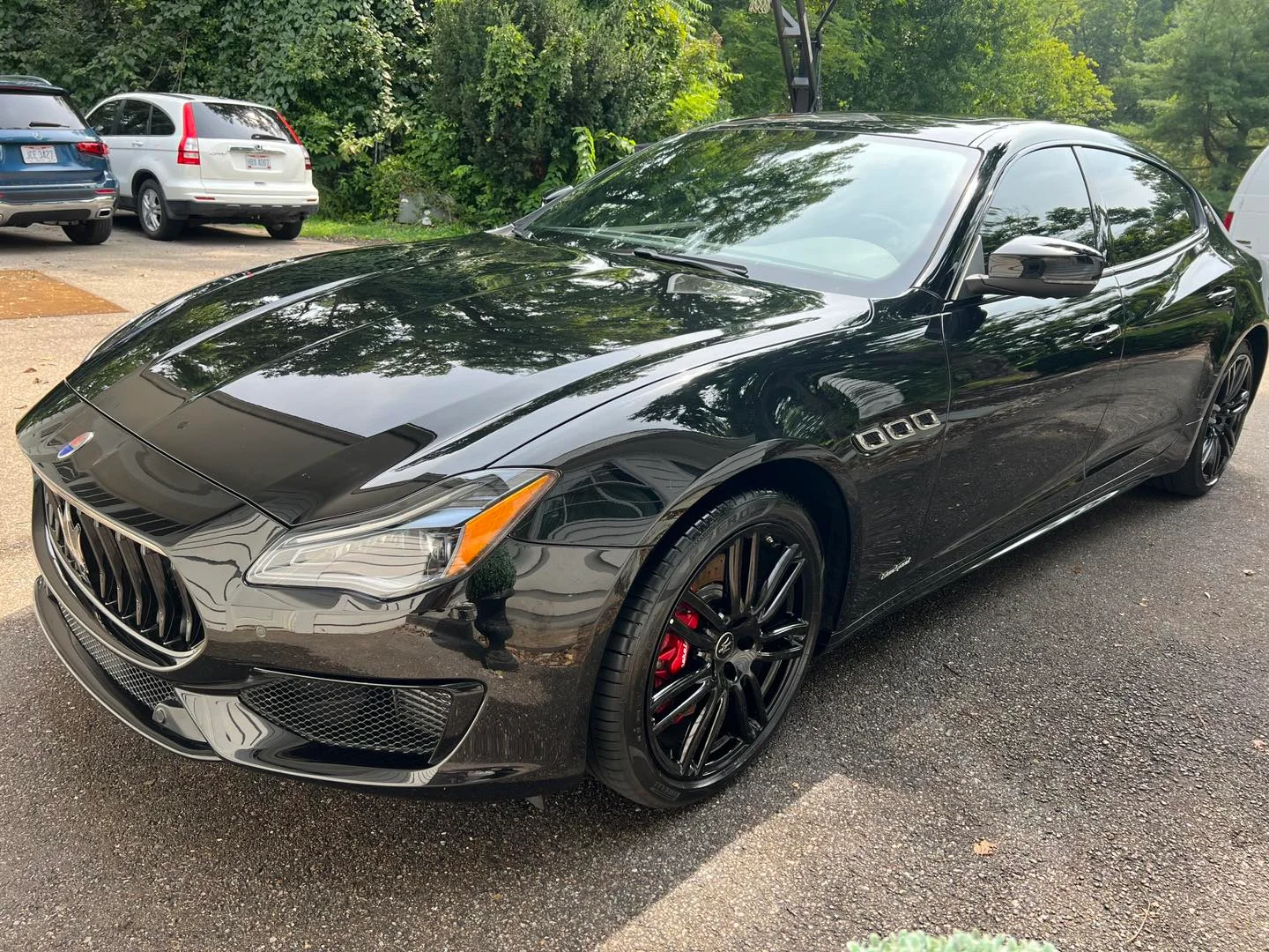 Glossy black sedan featured in Detail Dash’s work gallery